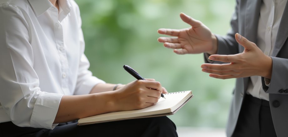 Business meeting with note taking